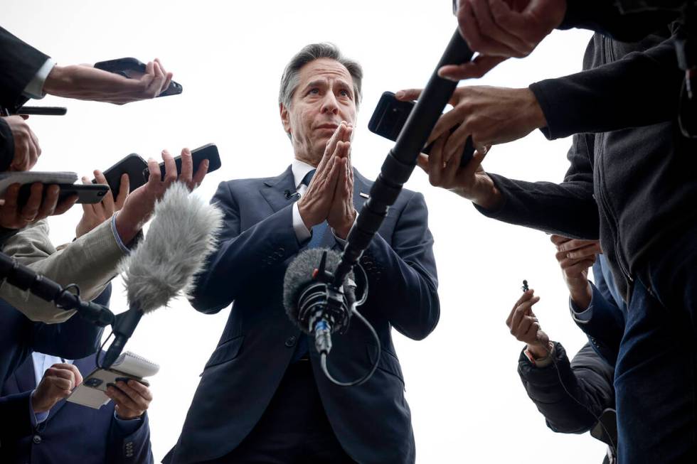 U.S. Secretary of State Antony Blinken speaks to members of the media before boarding his plane ...