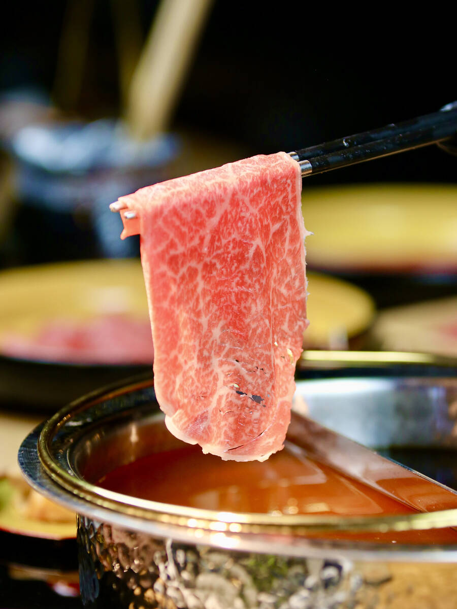 Wagyu beef cooking at Mikiya Wagyu Shabu House, a high-end hot pot spot that opened Jan. 1, 202 ...