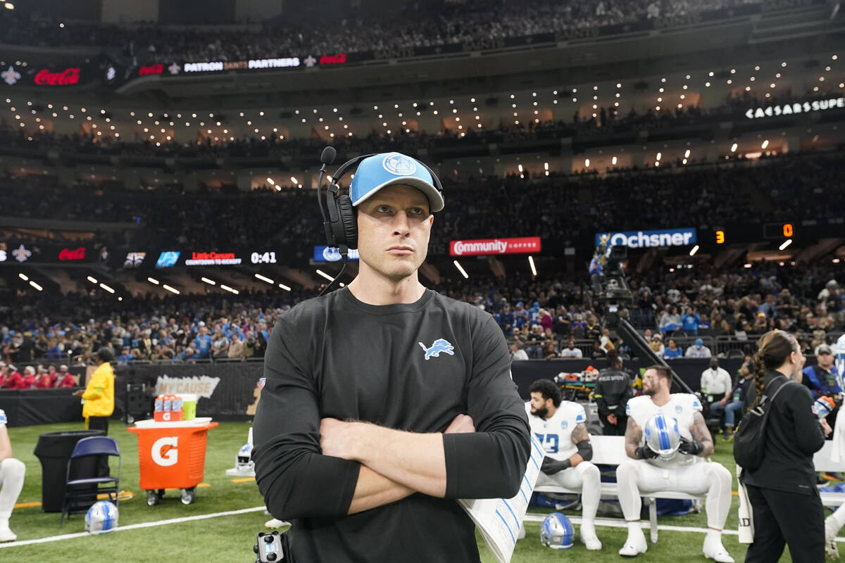 Detroit Lions offensive coordinator Ben Johnson stands on the sideline before an NFL football g ...