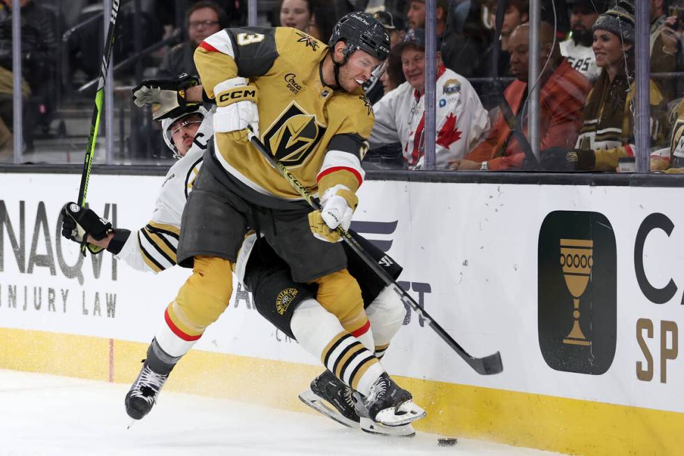 Golden Knights defenseman Brayden McNabb (3) collides with Bruins left wing Brad Marchand (63) ...