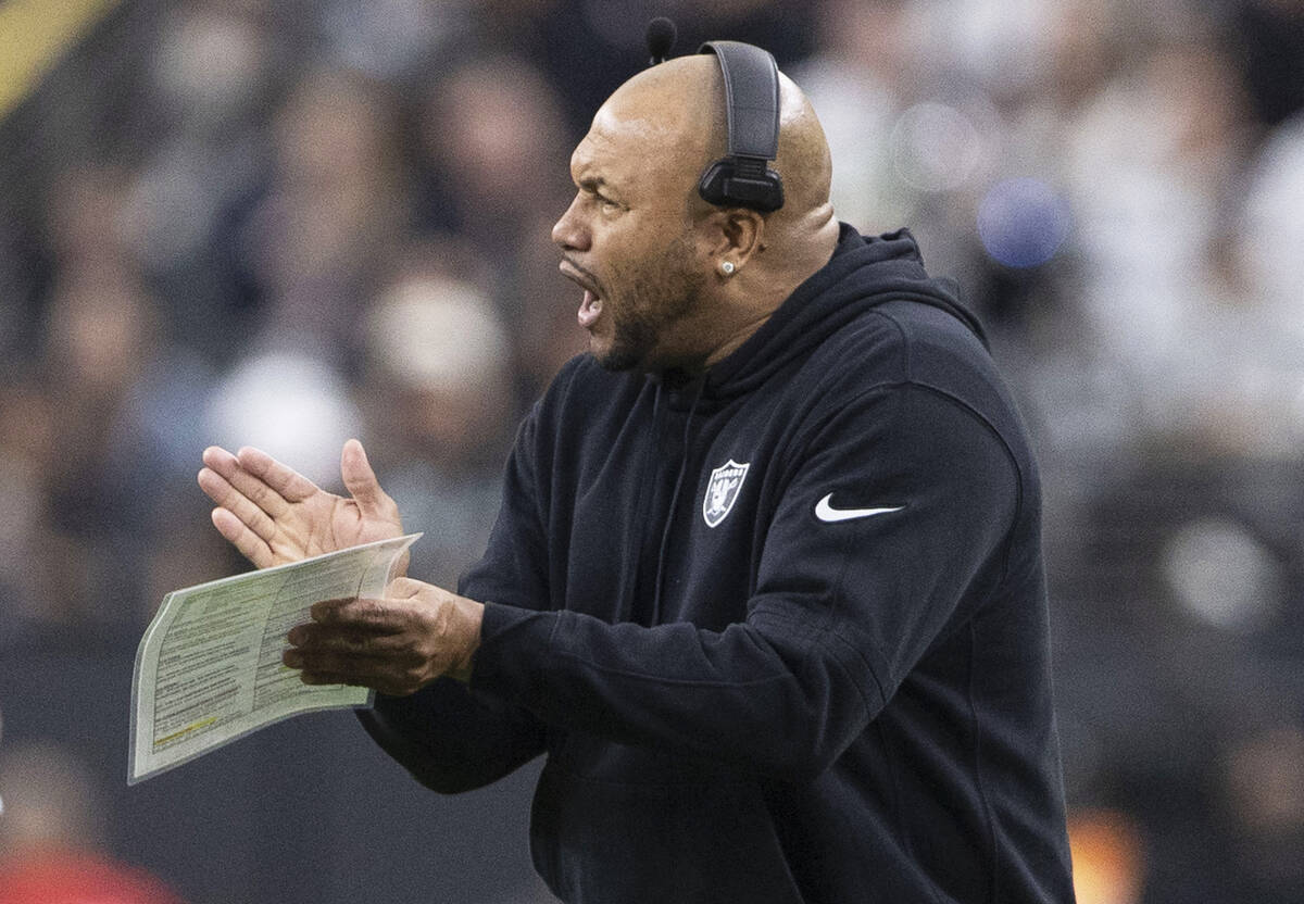 Raiders interim head coach Antonio Pierce applauds the team during the first half of an NFL gam ...