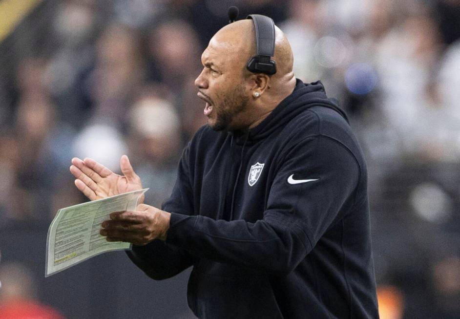 Raiders interim head coach Antonio Pierce applauds the team during the first half of an NFL gam ...
