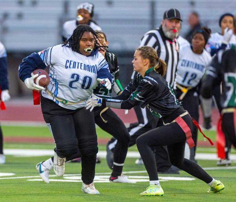 Centennial receiver Sah'Reniti Blazio (20) has her flag pulled by Palo Verde defender Alexis Lu ...