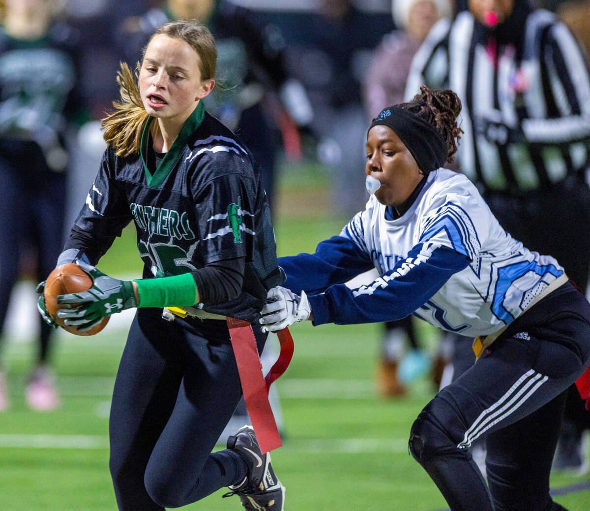 Palo Verde runner Olivia Perkins (25) is chased down by Centennial defender Carissa McWilliams ...