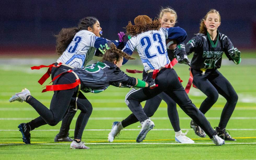 Centennial runner Dakota Washinton (23) is swarmed by Palo Verde defenders during the first hal ...