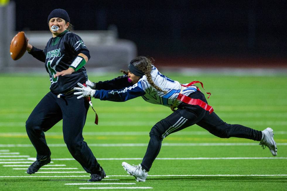 Palo Verde quarterback Jordan Katz (6) looks to pass as Centennial defender Vari Rua (5) closes ...