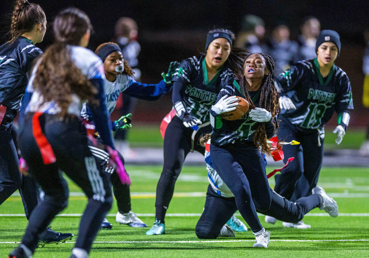 Centennial runner Sorrell James (1) is pulled down by a Palo Verde defender during the second h ...