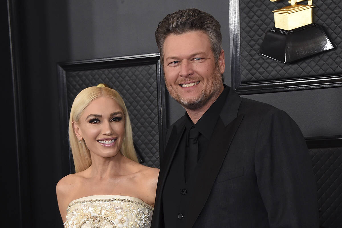 Gwen Stefani, left, and Blake Shelton arrive at the 62nd annual Grammy Awards in Los Angeles in ...