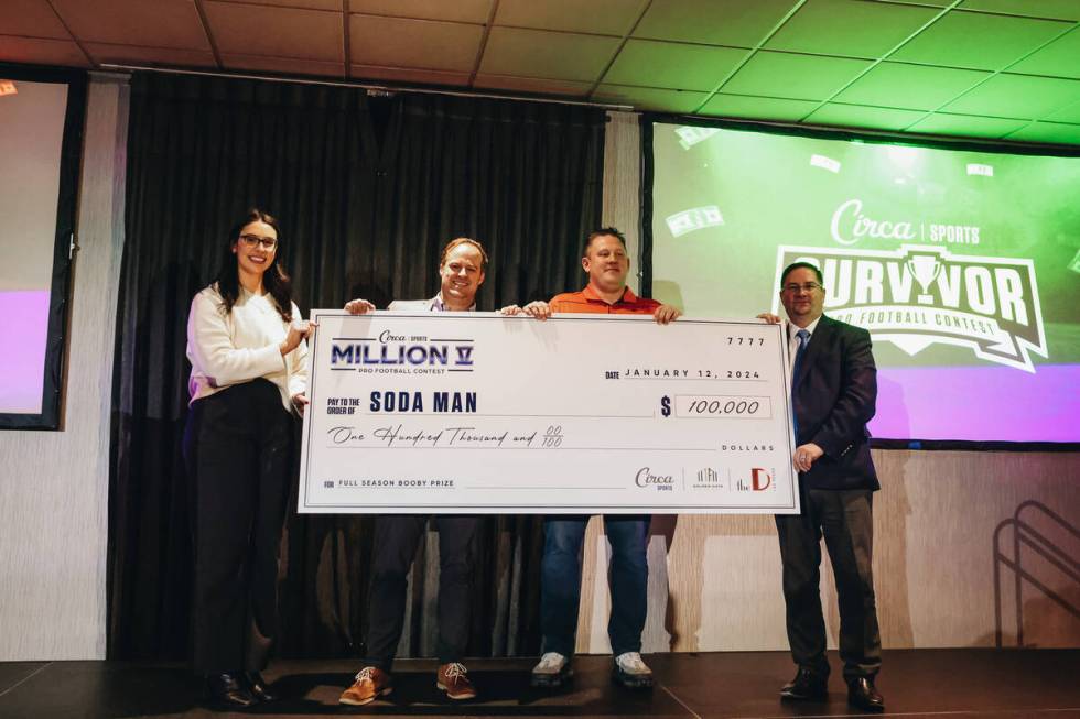 Circa Survivor last place booby prize winners, Soda Man, pose with a giant check during an awar ...