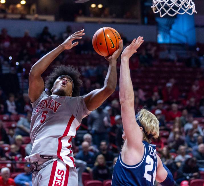 UNLV forward Rob Whaley Jr. (5) elevates over Utah State Aggies forward Karson Templin (24) for ...