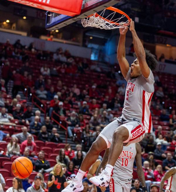 UNLV forward Rob Whaley Jr. (5) dunks the ball against the Utah State Aggies during the first h ...