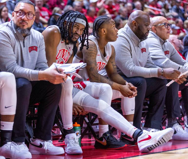 UNLV forward Keylan Boone (20) winces while grabbing his left knee on the bench against the Uta ...