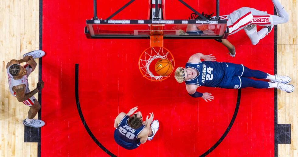 Utah State Aggies forward Karson Templin (24) watches the ball fall through the basket as UNLV ...