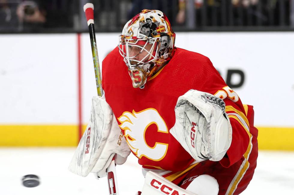 Flames goaltender Jacob Markstrom (25) prepares to save the puck during the first period of an ...