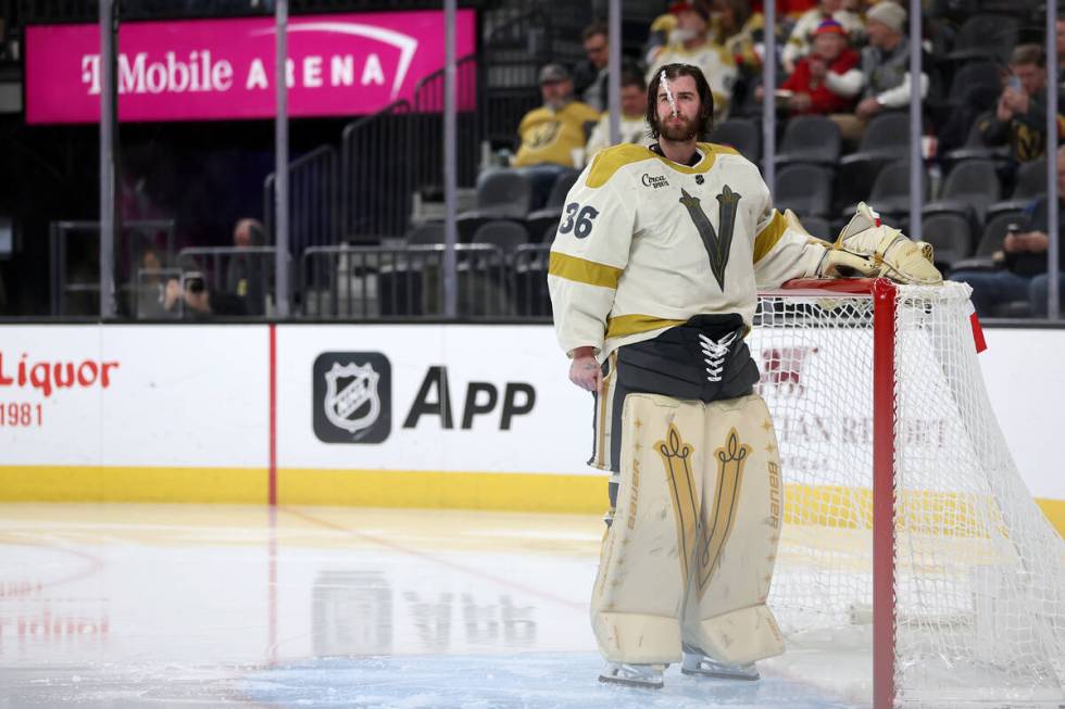 Golden Knights goaltender Logan Thompson (36) spits water during the second period of an NHL ho ...