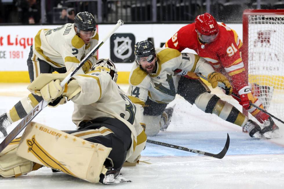 Golden Knights defenseman Zach Whitecloud (2), goaltender Logan Thompson (36) and defenseman Ni ...