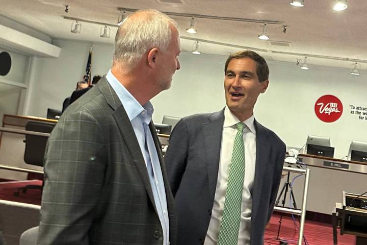 Oakland Athletics President Dave Kaval, right, talks with LVCVA CEO Steve Hill before the Aug. ...