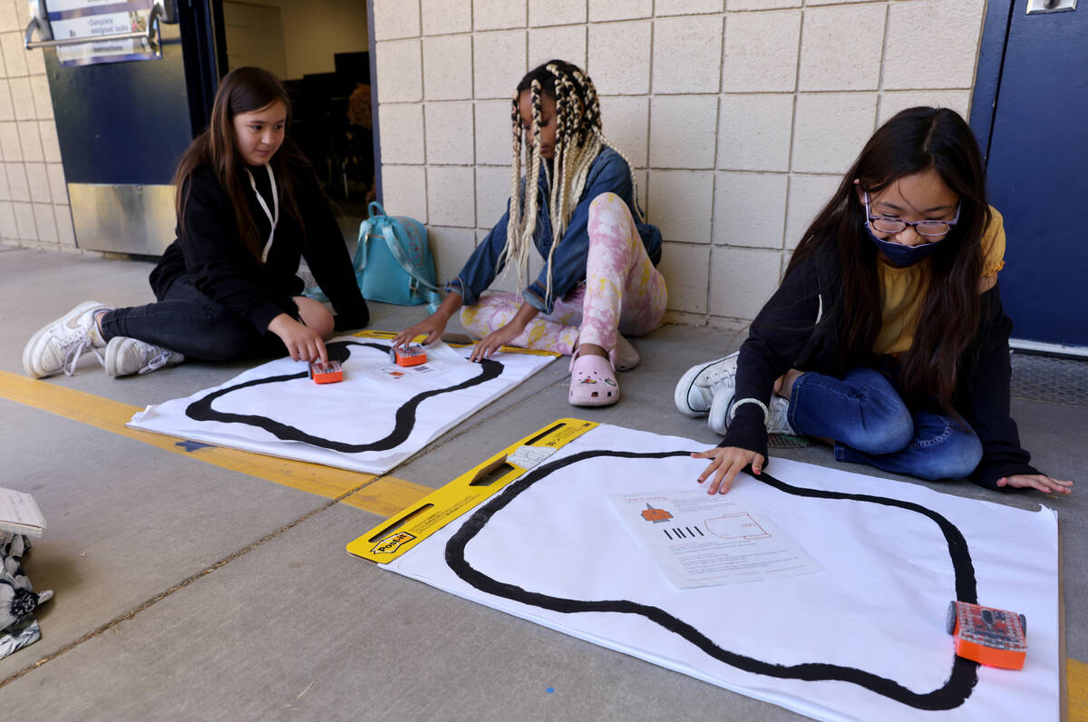 Alexis Duran, from left, and Kailynne Colon-Morgan and Jenny Moctezuma show their robot cars du ...