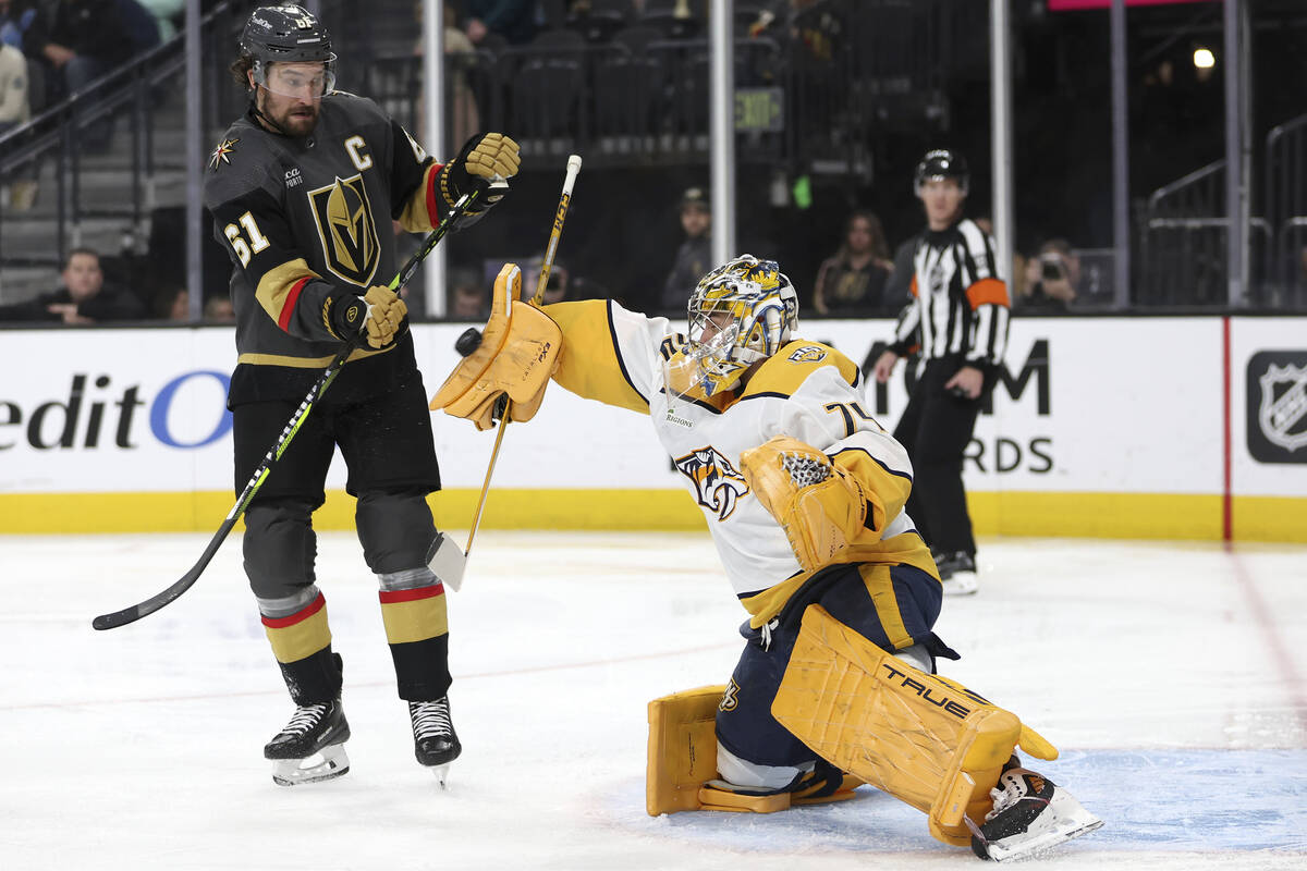 Nashville Predators goaltender Juuse Saros (74) saves the puck against Vegas Golden Knights rig ...