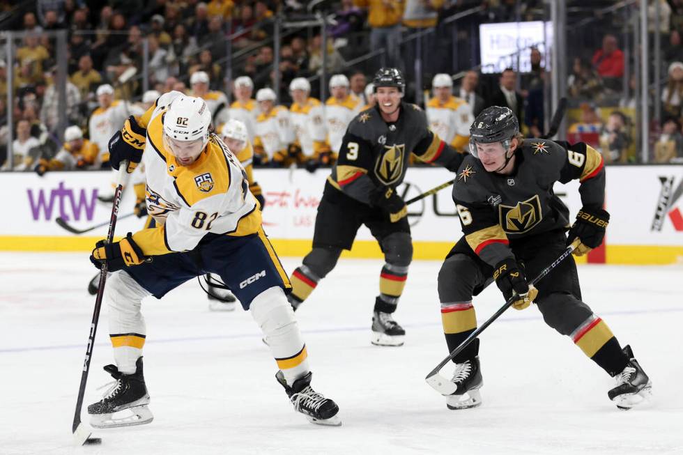 Nashville Predators center Tommy Novak (82) skates with the puck against Vegas Golden Knights d ...