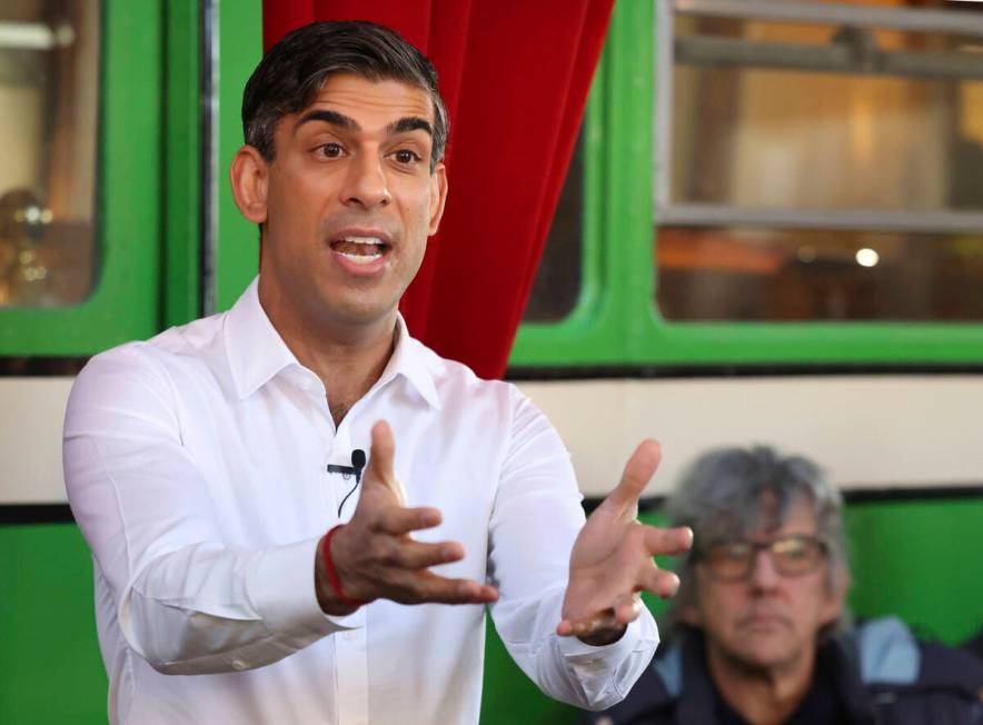 Britain's Prime Minister Rishi Sunak gestures during his visit to The Boatyard in Leigh-on-Sea, ...