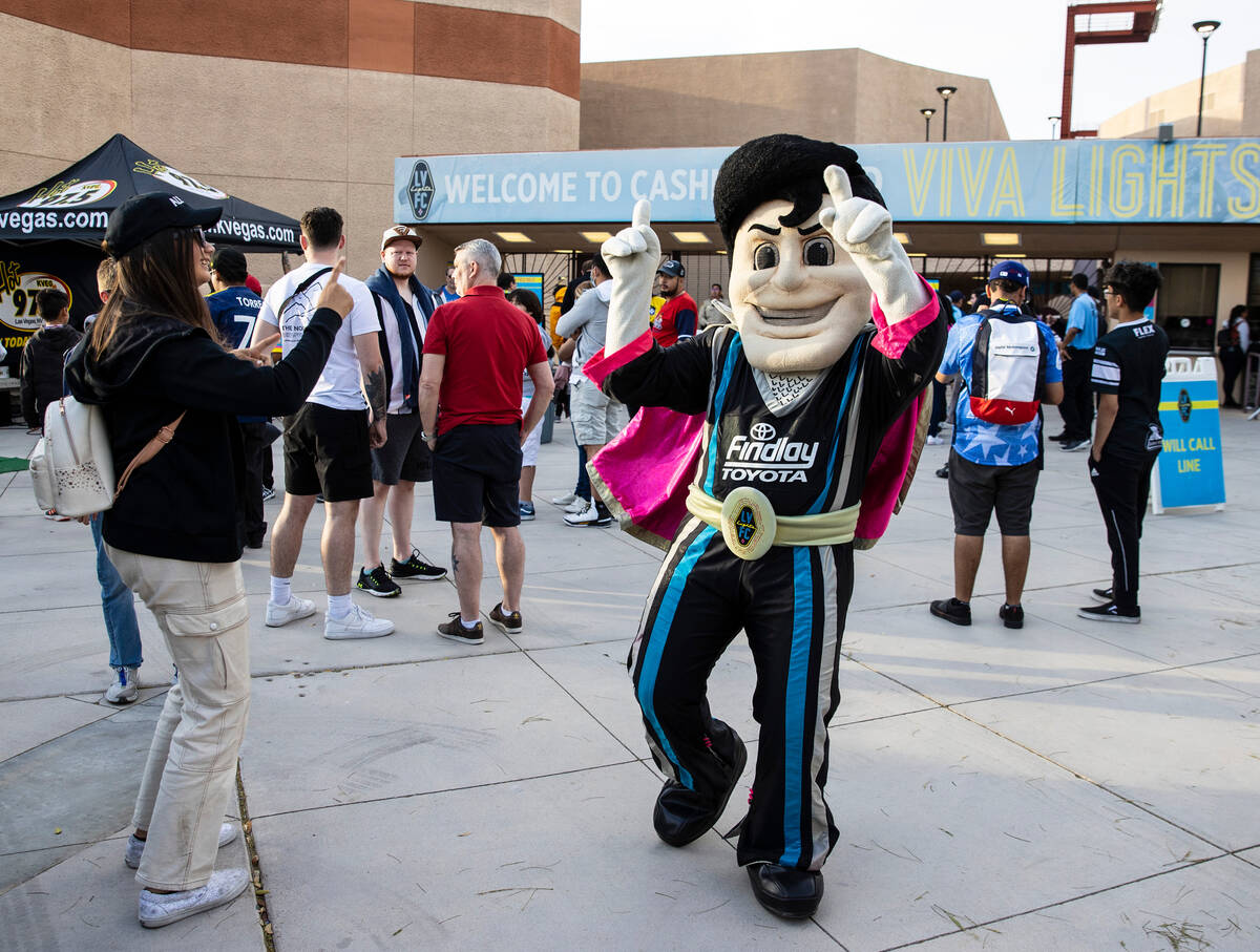 The Las Vegas Lights FC mascot “Cash the Soccer Rocker" entertains fans outside of Cashman Fi ...