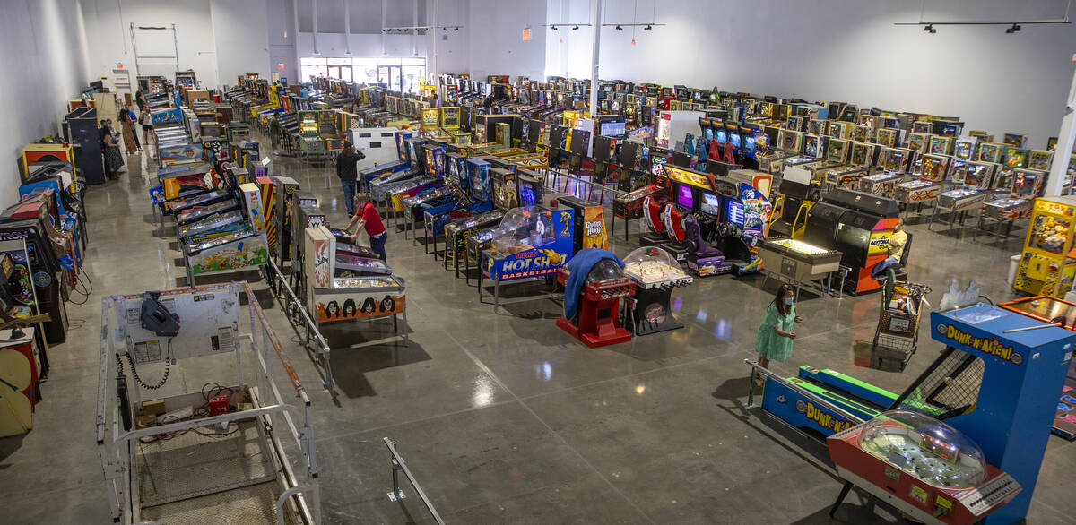 Customers enjoy playing some of the hundreds of games as the Pinball Hall of Fame is in their n ...