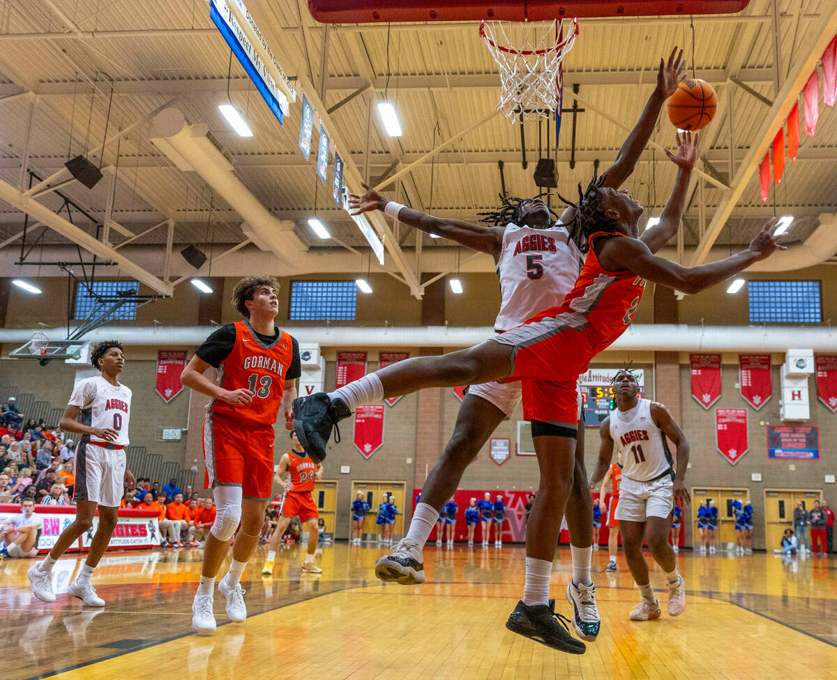 Arbor View forward Pharaoh Compton (5) extends to block a shot inside by Bishop Gorman forward ...
