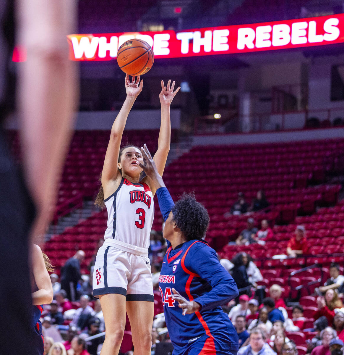 UNLV Lady Rebels guard Kiara Jackson (3) scores over Arizona Wildcats guard Salimatou Kourouma ...