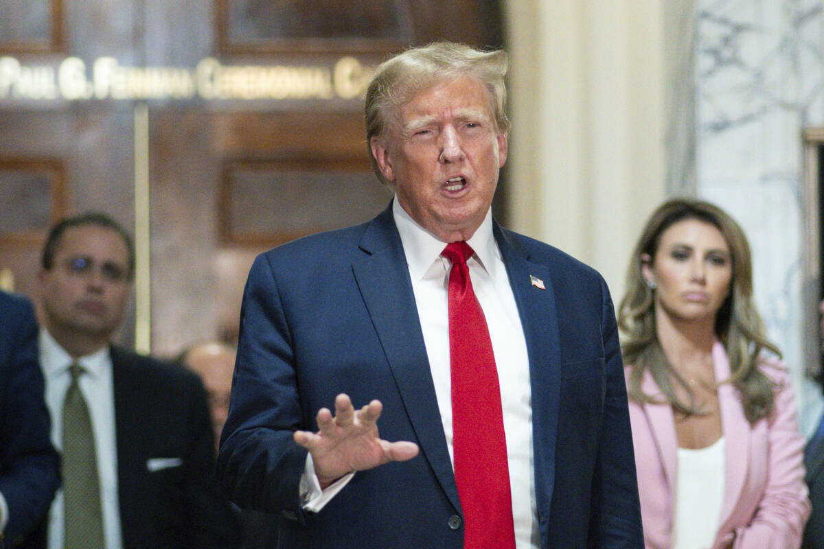 FILE - Former President Donald Trump speaks after exiting the courtroom for a break at New York ...