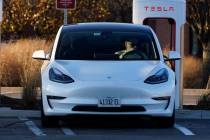 A Tesla electric vehicle is seen at a Tesla electric vehicle charging station at Willow Festiva ...