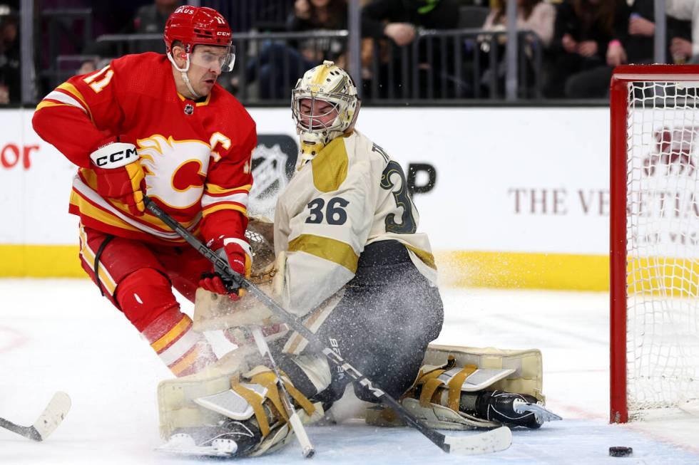 Flames center Mikael Backlund (11) scores a goal on Golden Knights goaltender Logan Thompson (3 ...