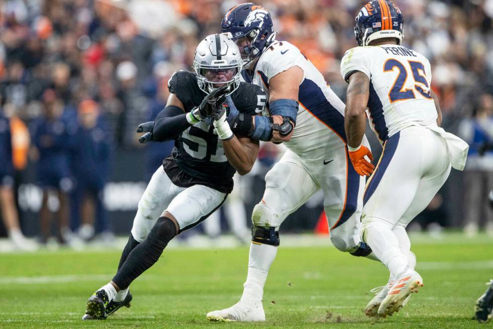 Raiders defensive end Malcolm Koonce (51) works past Denver Broncos guard Quinn Meinerz (77) as ...