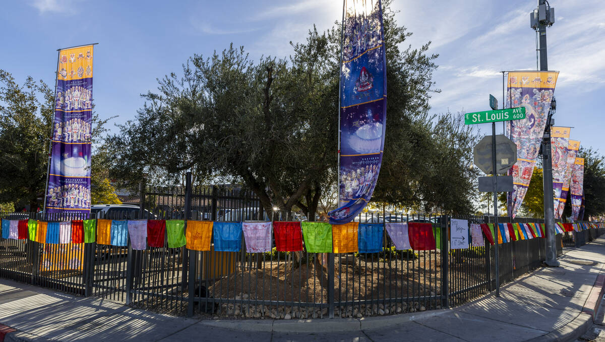 Prayer flags and banners line the outside fence during the opening ceremony of the Benevolence ...