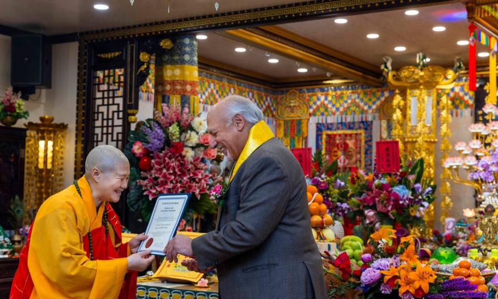 Holy Guru Zhengda Jiaozun is presented with a certificate from Nevada Lieutenant Governor Stavr ...