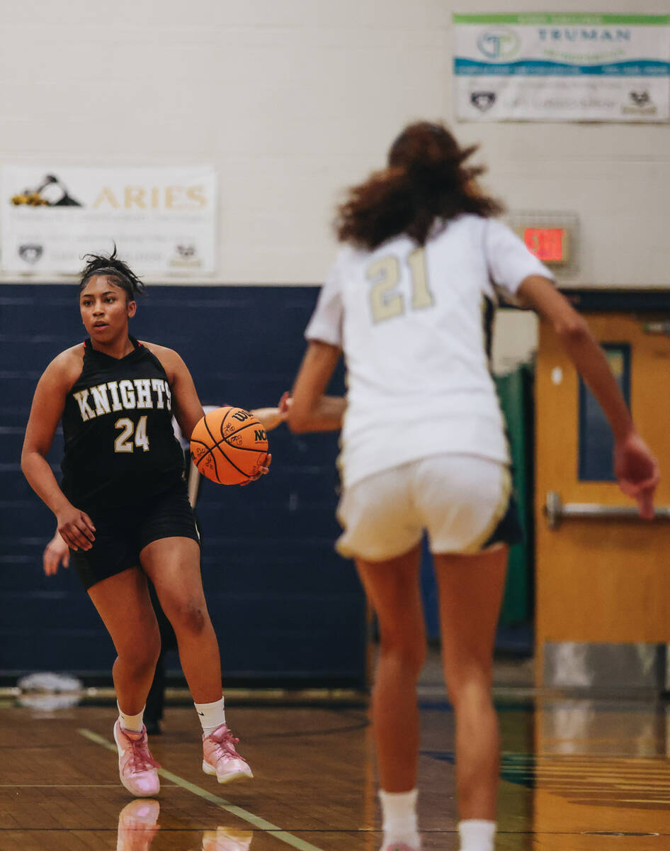 Democracy Prep guard Demi Thompson Lopez (24) dribbles the ball down the court during a game ag ...