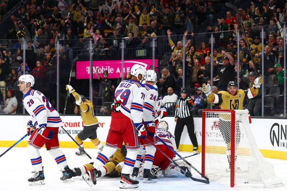 Golden Knights right wing Jonathan Marchessault, right, celebrates after assisting Golden Knigh ...