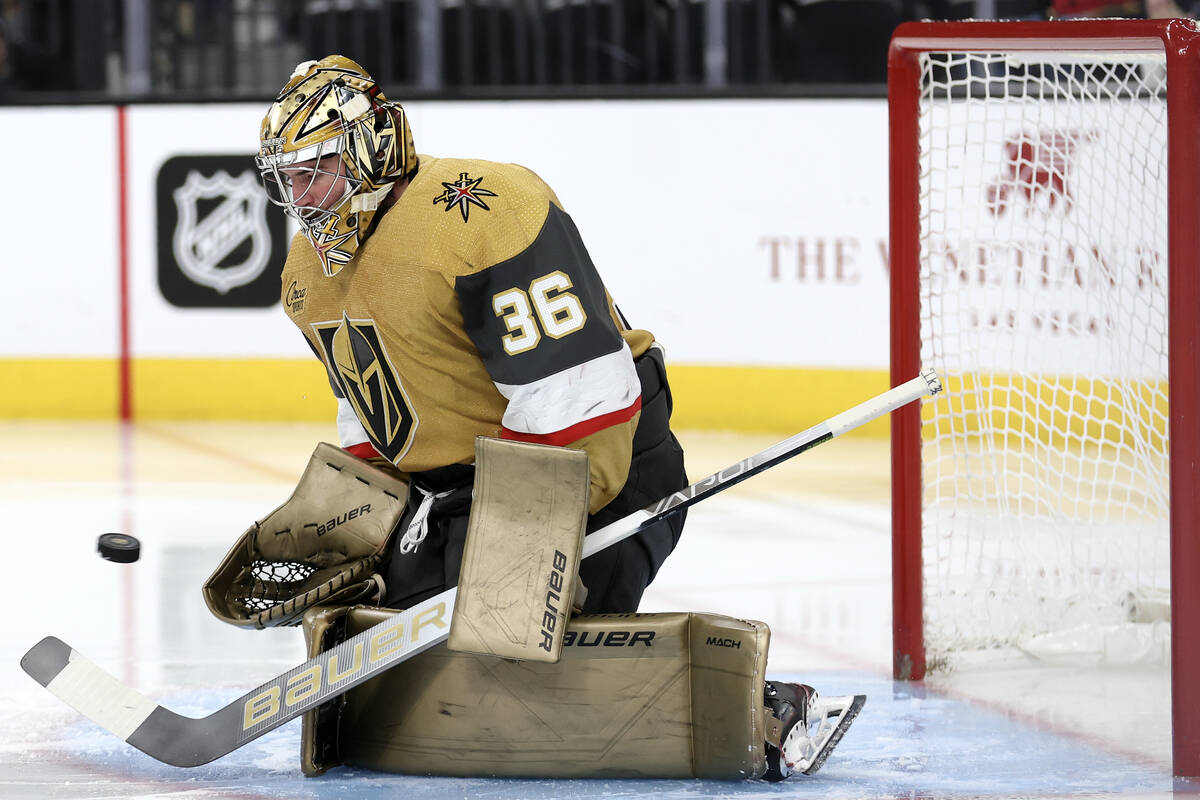 Golden Knights goaltender Logan Thompson (36) saves the puck during the second period of an NHL ...