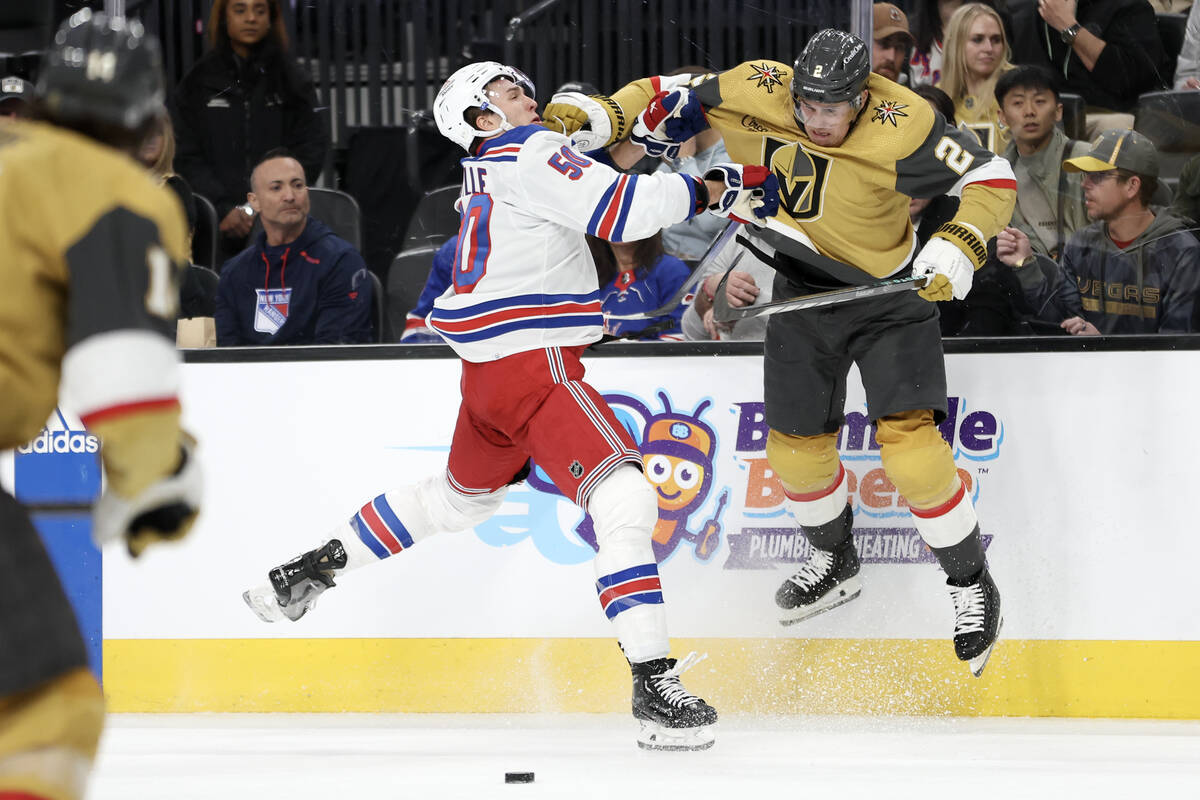 Rangers left wing Will Cuylle (50) and Golden Knights defenseman Zach Whitecloud (2) collide du ...