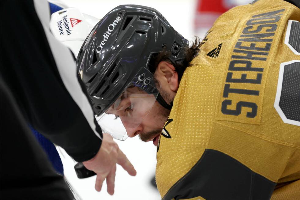 Golden Knights center Chandler Stephenson (20) watches the puck as the referee begins a face-of ...