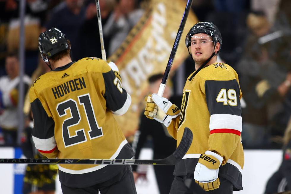 Golden Knights center Ivan Barbashev (49) and center Brett Howden (21) celebrate after winning ...