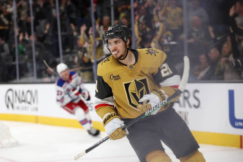 Golden Knights center Brett Howden (21) skates around the net after scoring an empty net goal d ...