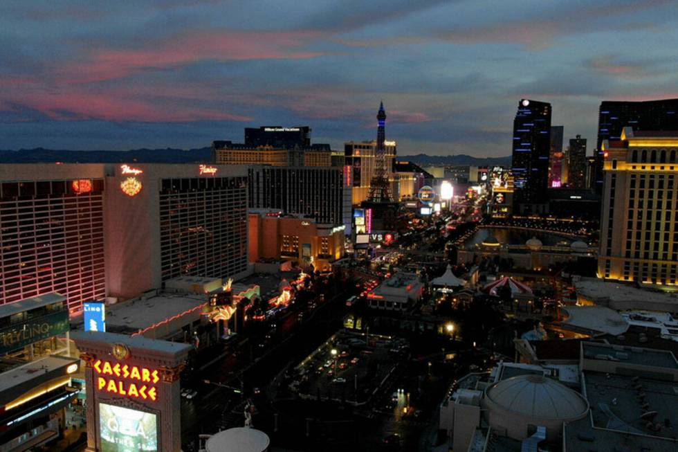 Aerial view looking south down the Las Vegas Strip at sunset on Monday, December 6, 2021. (Mich ...