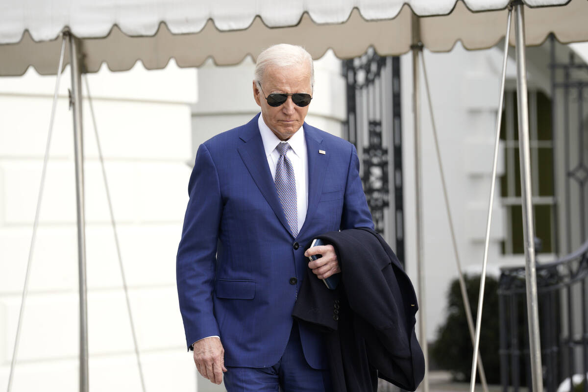 President Joe Biden walks to speak to the media before boarding Marine One on the South Lawn of ...