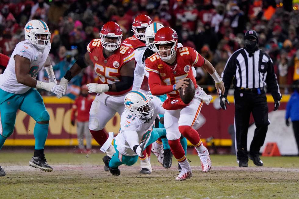 Kansas City Chiefs quarterback Patrick Mahomes (15) runs against Miami Dolphins defensive end E ...