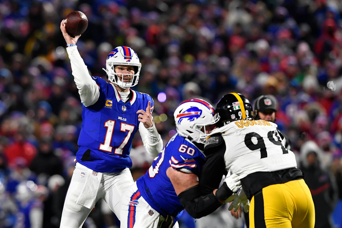 Buffalo Bills quarterback Josh Allen (17) throws as center Mitch Morse (60) blocks Pittsburgh S ...