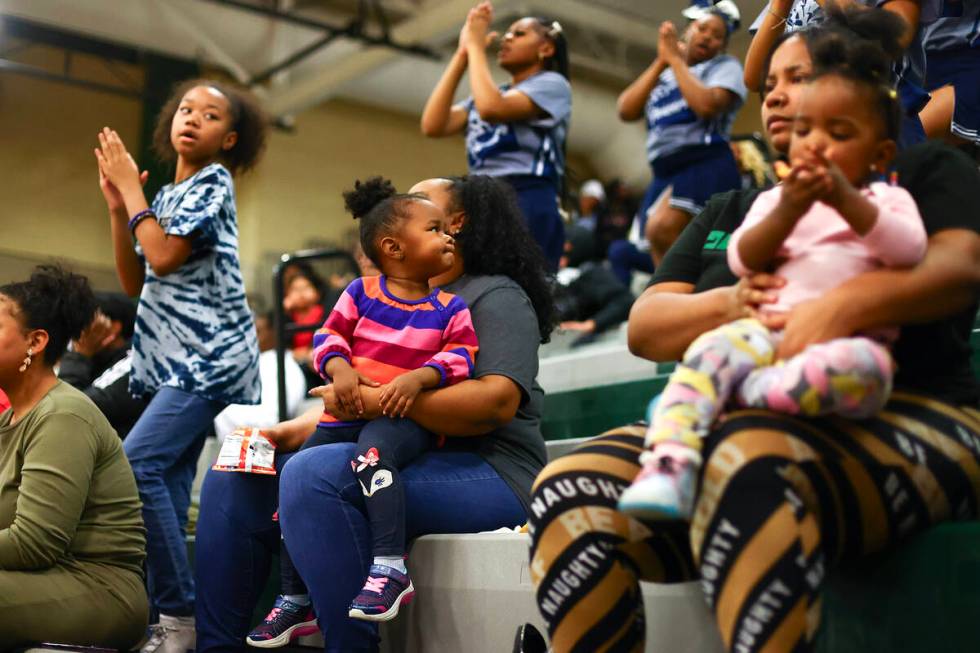 Giada Thorns (2), center, watches her older sister perform on Canyon Springs’ cheerleadi ...