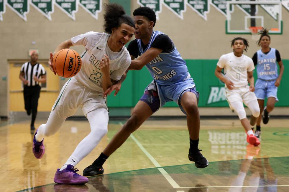 Rancho guard Jakoi Lide (2) drives pass Canyon Springs guard Wanje Haywood (10) during the firs ...