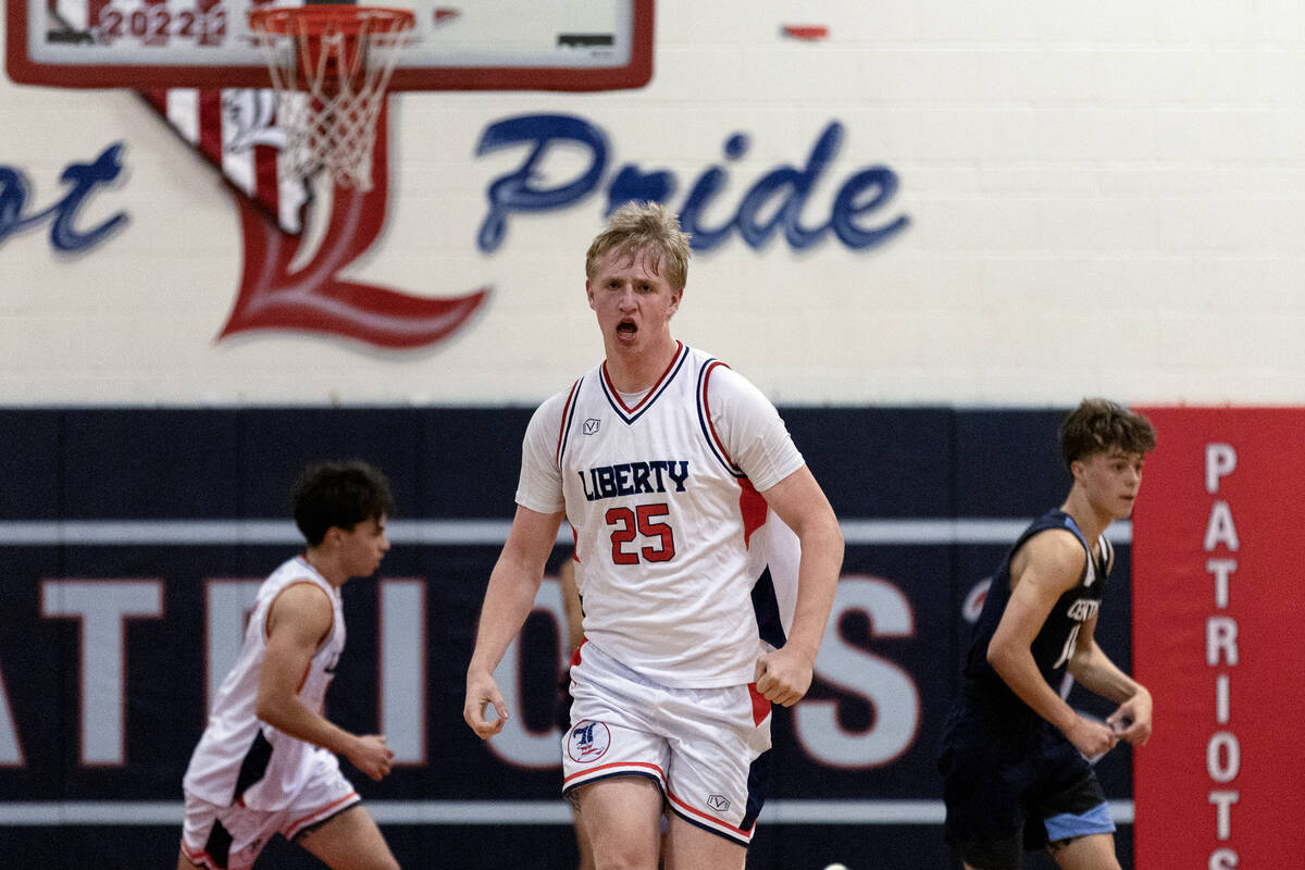 Liberty forward Tyler Bright (25) celebrates after dunking during the first half of a boys high ...