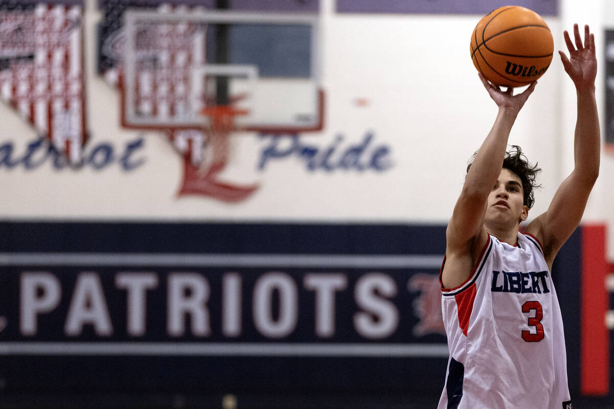Liberty guard Kaeden Castillero (3) shoots the final free throws of a boys high school basketba ...